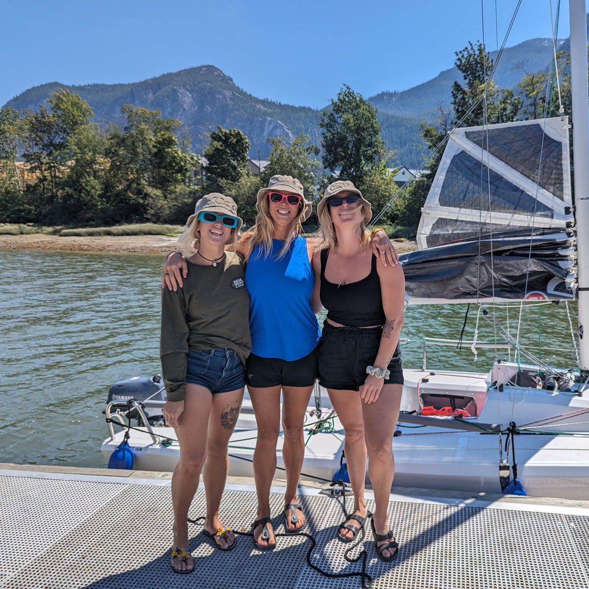 Sailors together beside an InFlow keelboat in Squamish
