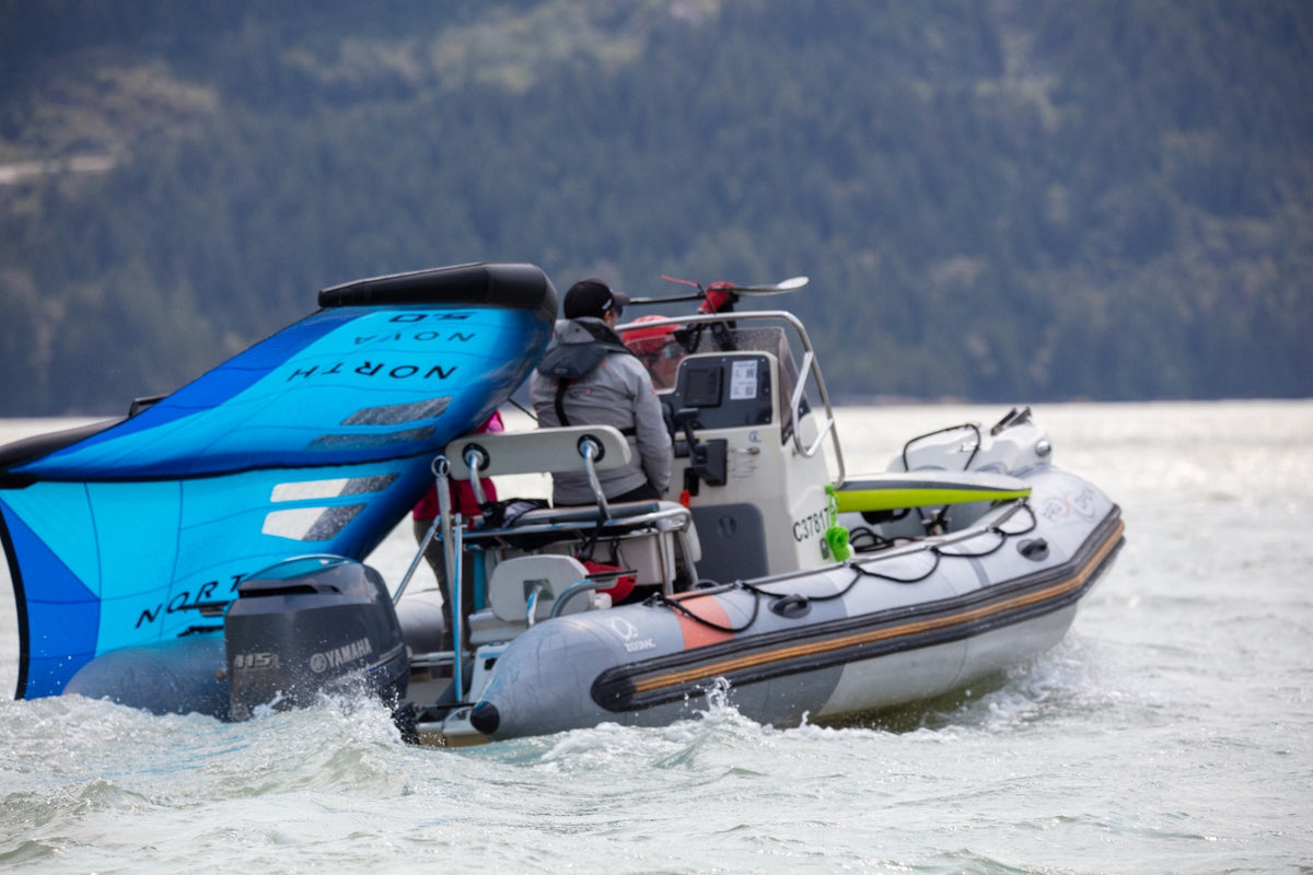 A support boat carrying wing foil equipment during BC Foil Fest